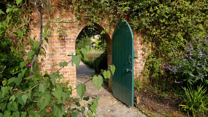 Brick arch into walled kitchen garden Trengwainton, Cornwall